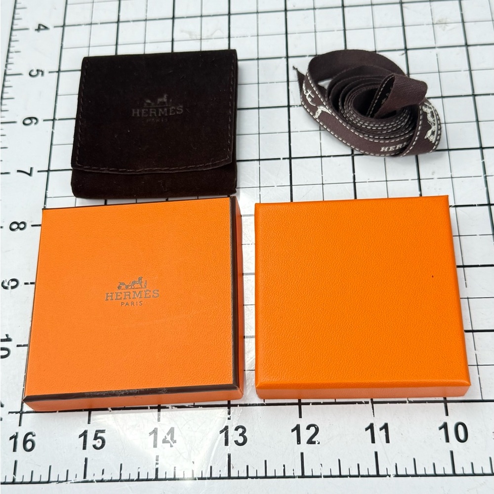 Hermes Orange and Black Storage Box. 3 by 3 inches, ribbon, brown pouch. - Picture 2 of 7